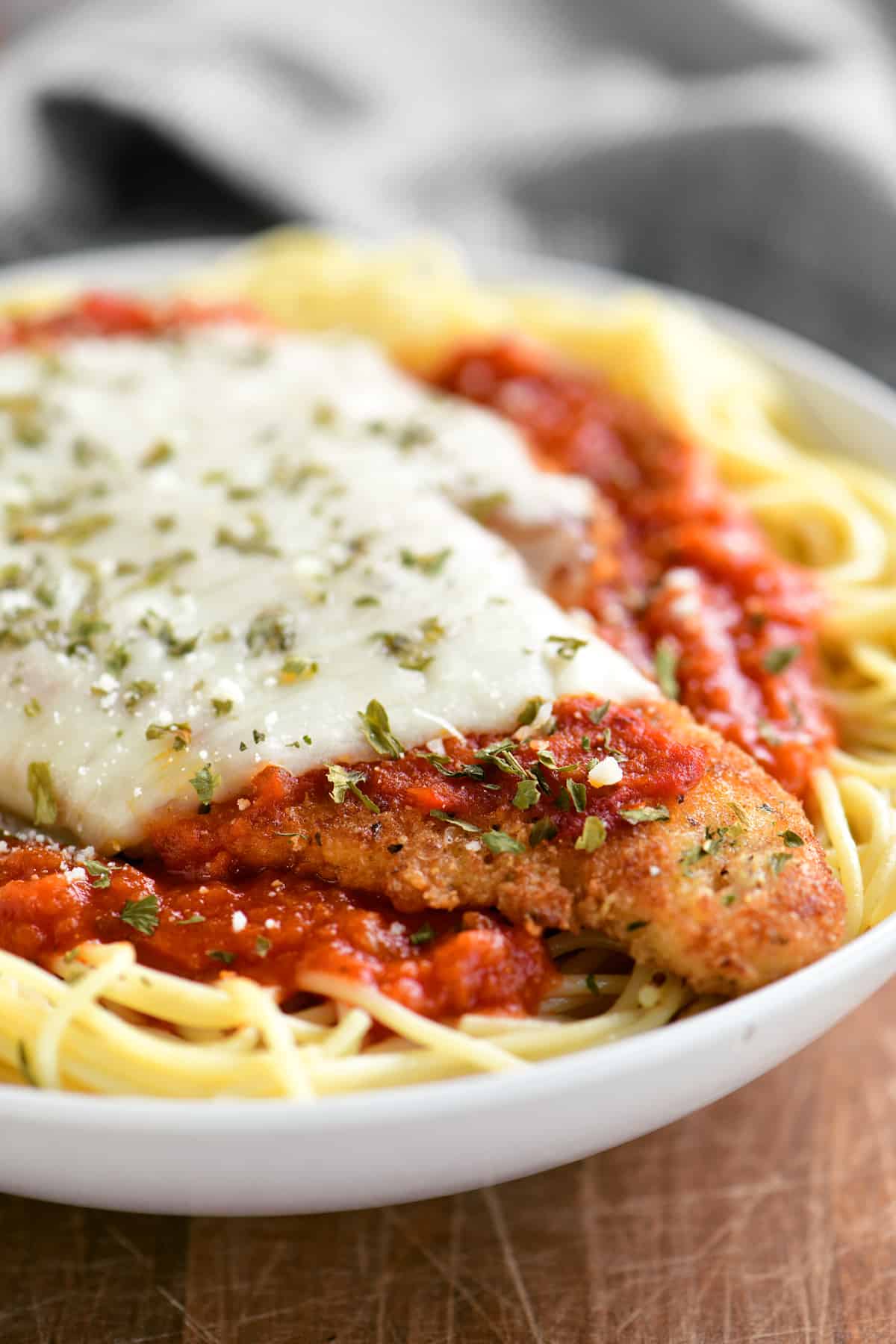 crispy chicken parmesan topped with melted cheese