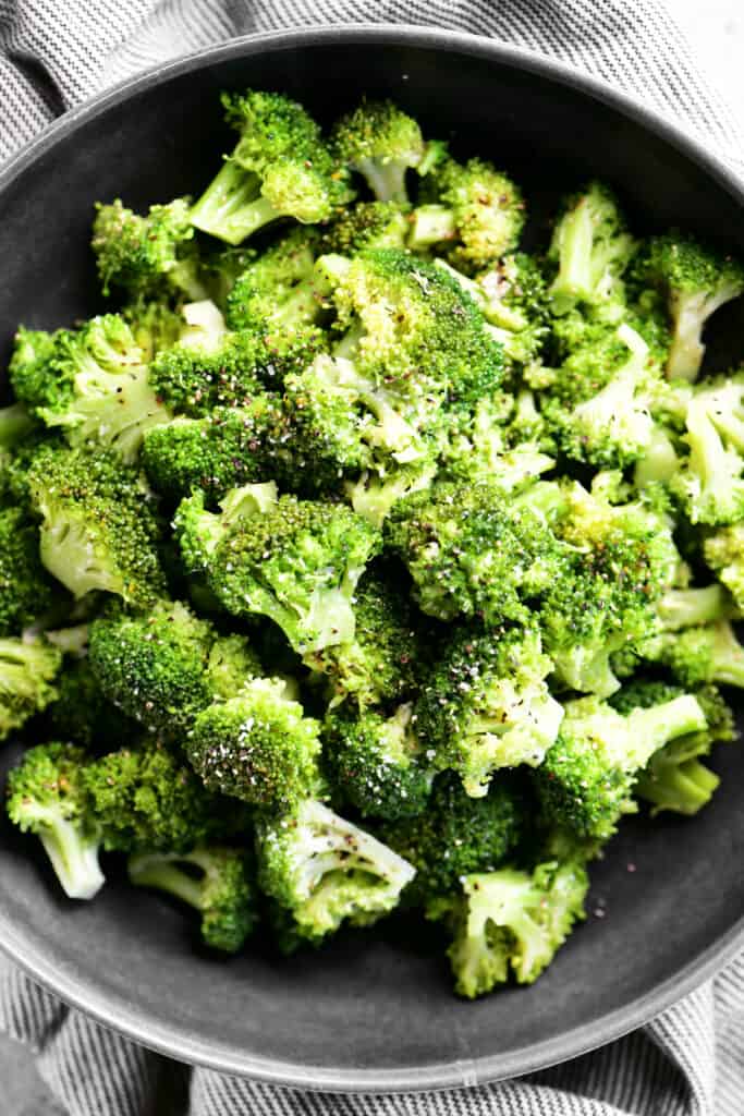 cooked broccoli in a black dish