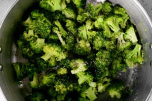 salt, pepper and broccoli in a cooking pot