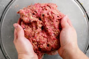 mixing meatloaf ingredients with hands