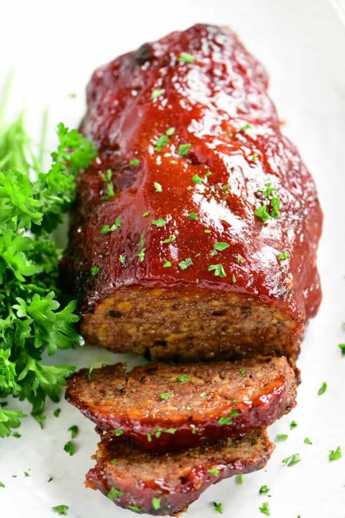 meatloaf with parsley garnish sliced