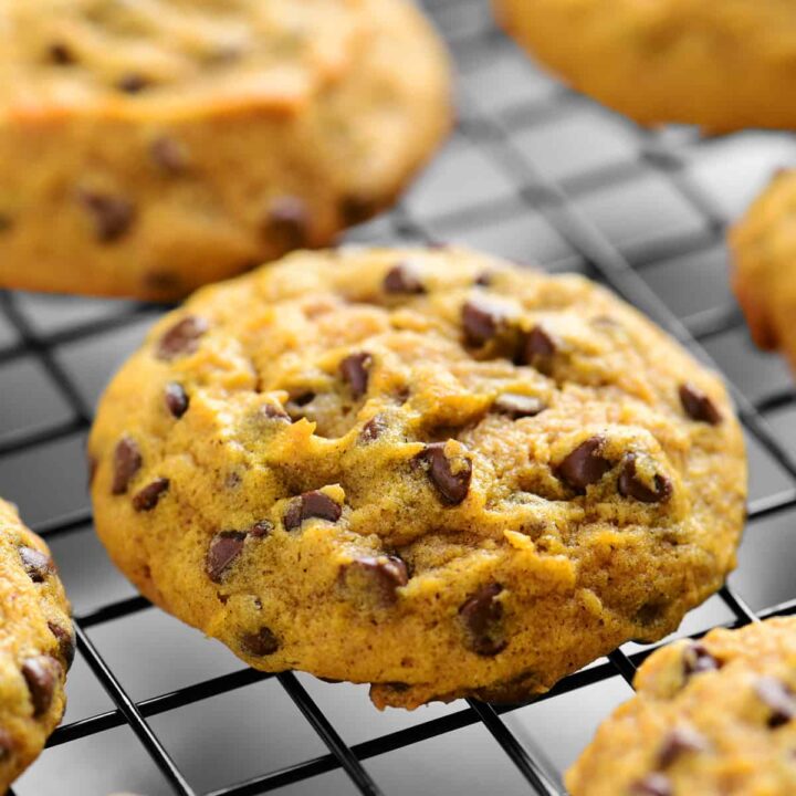 pumpkin chocolate chips cookies cooling on a wire rack