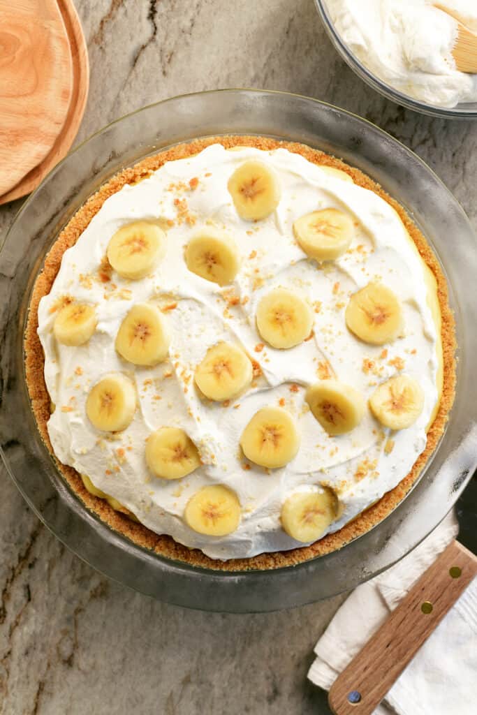 banana cream pie with whipped cream and banana slices on top