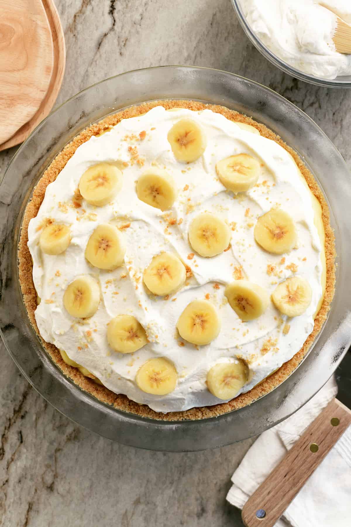 Banana cream pie with whipped cream on top.