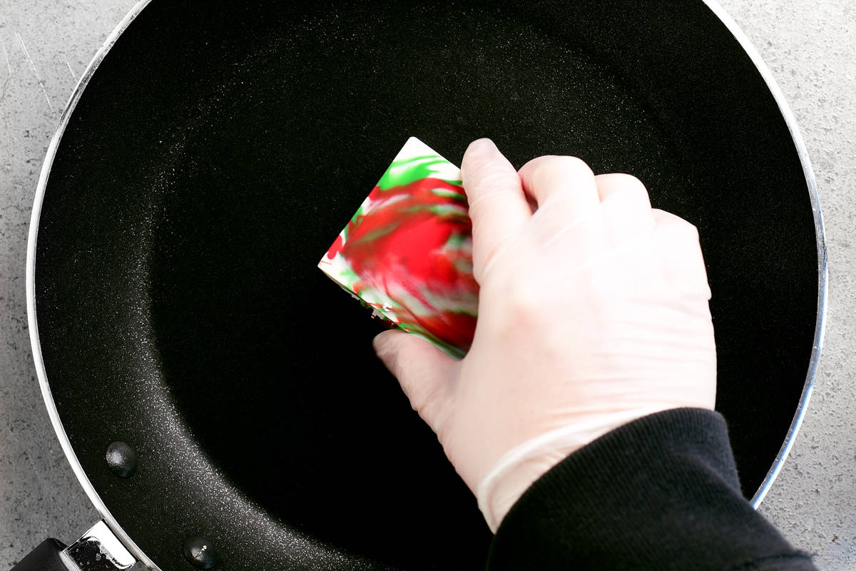 smoothing the chocolate gift on a hot skillet