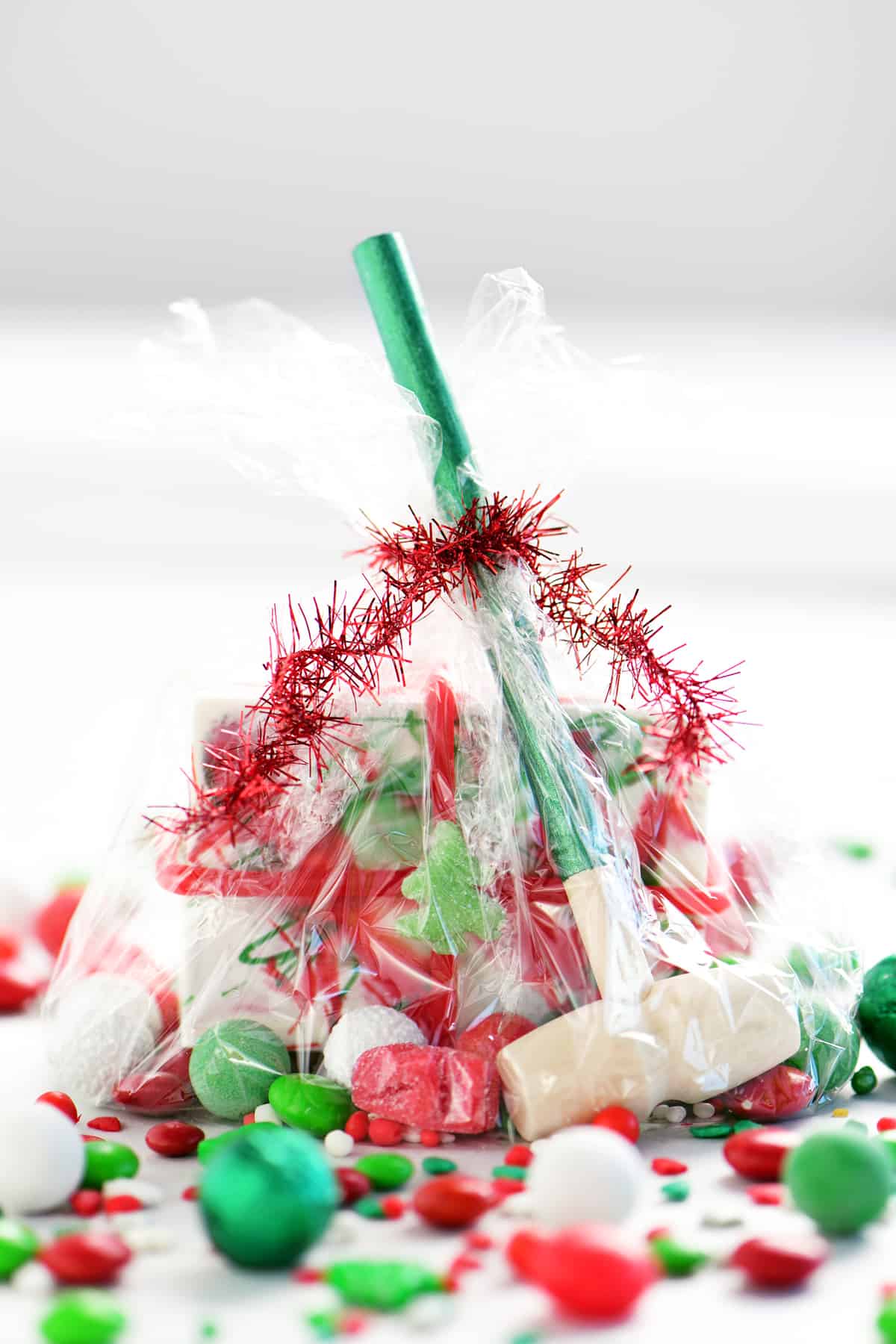 cellophane gift bag with candy and a small wooden mallet
