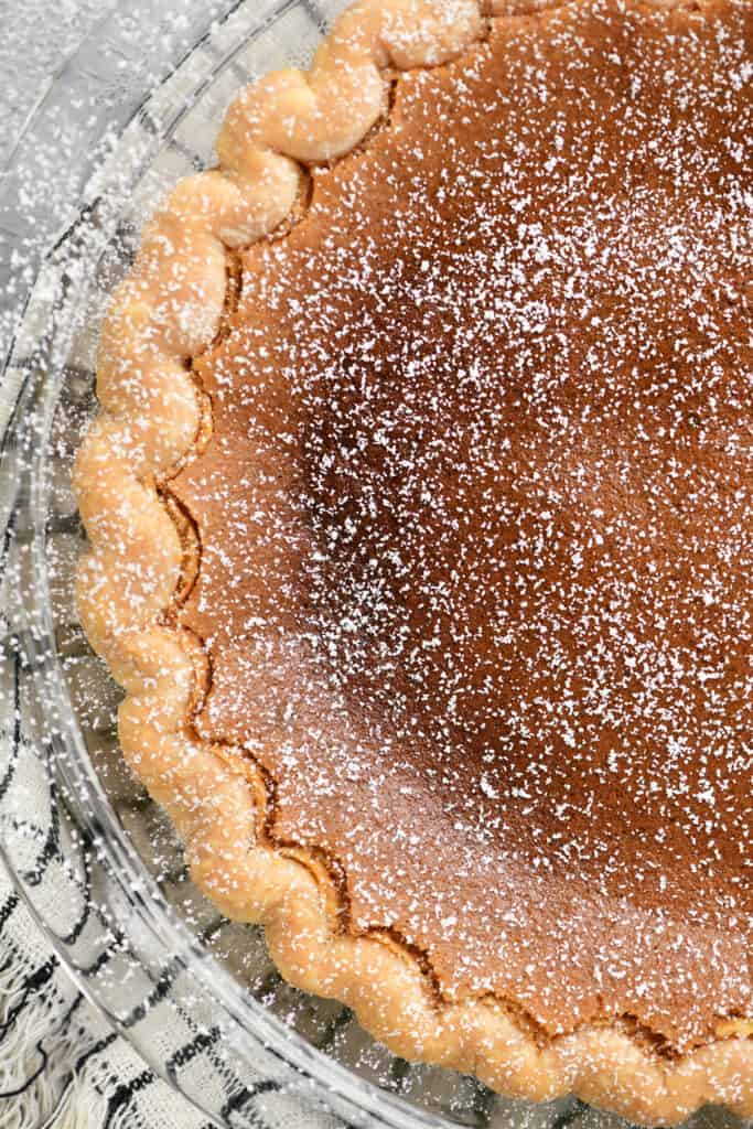 a pie with powdered sugar on top