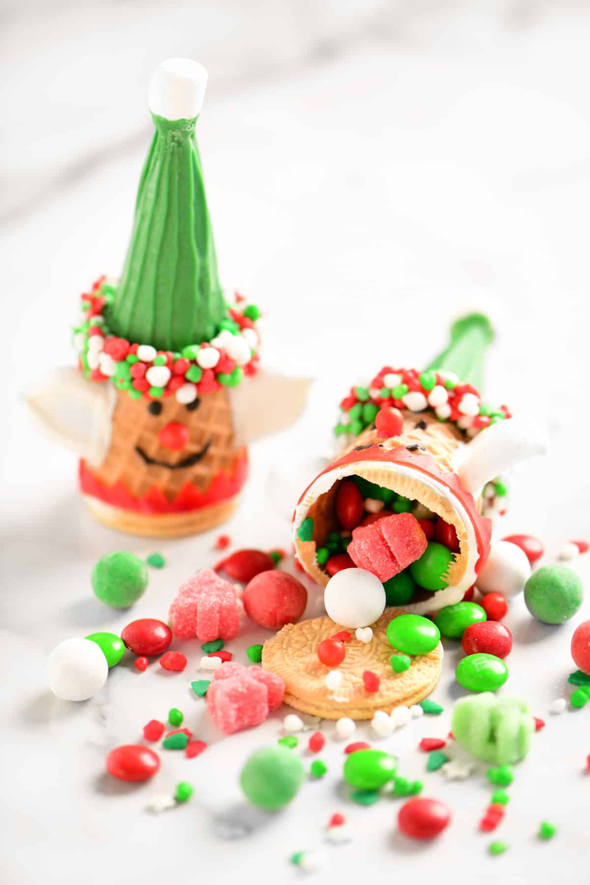 decorated ice cream cones with candy spilling out