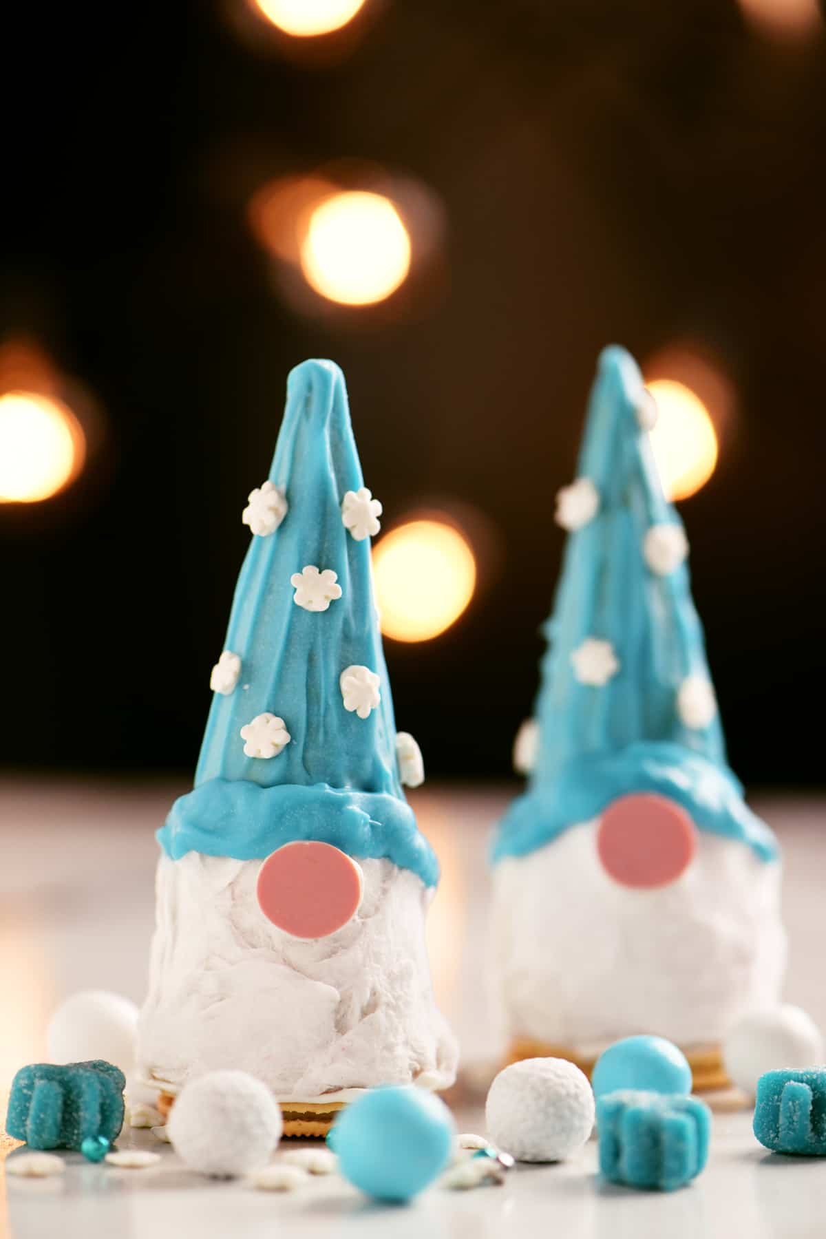 gnome Christmas cones on a table with blue and white candies
