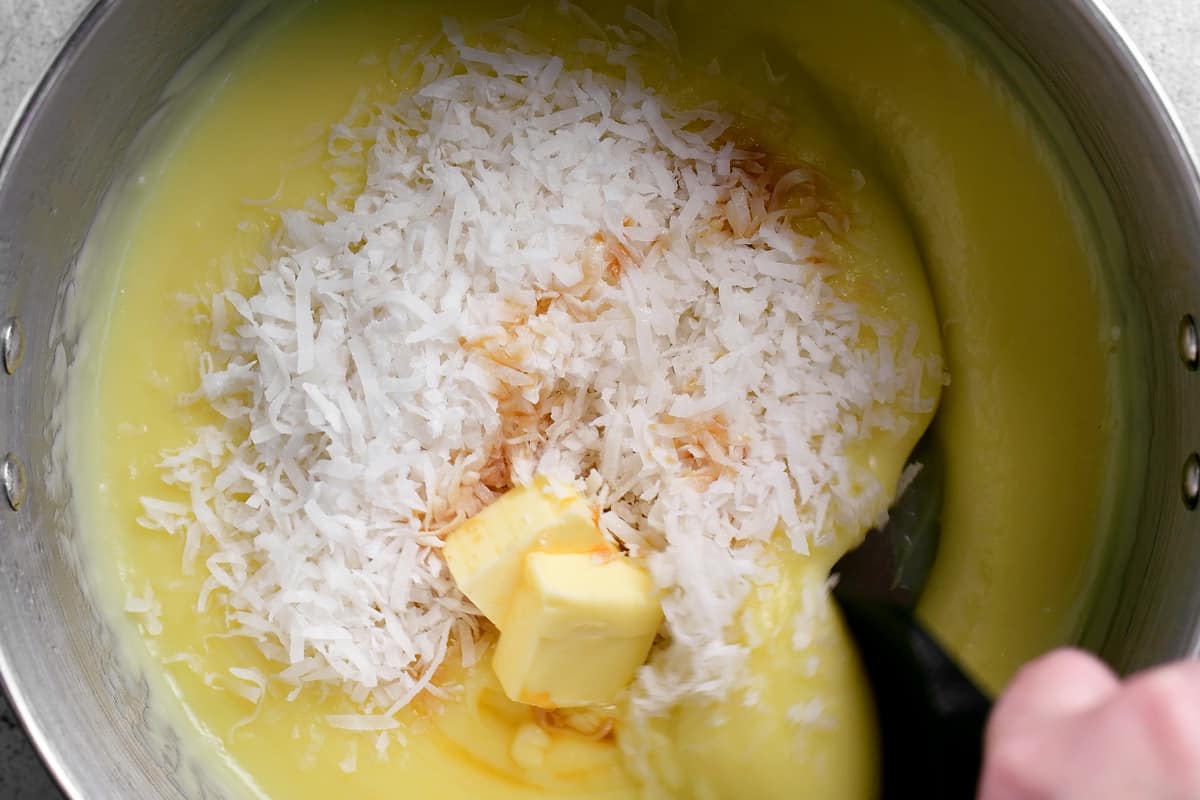 stirring coconut into melted butter