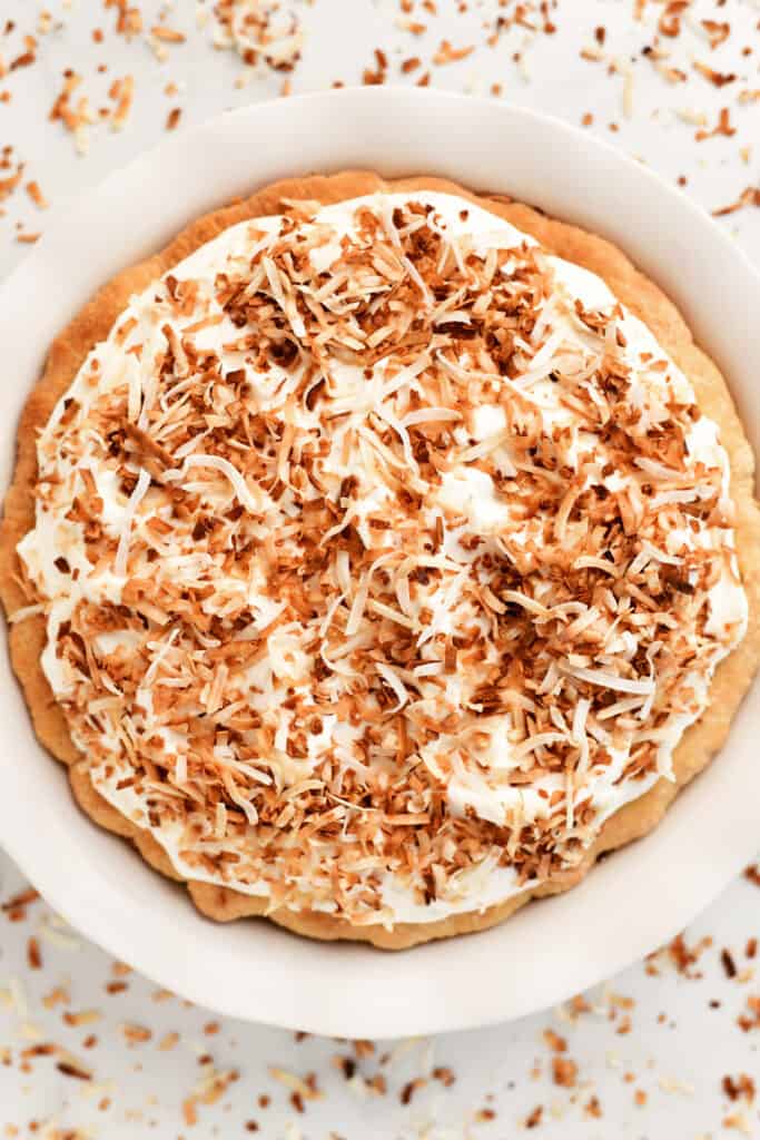 a topdown view of coconut cream pie in a pie dish