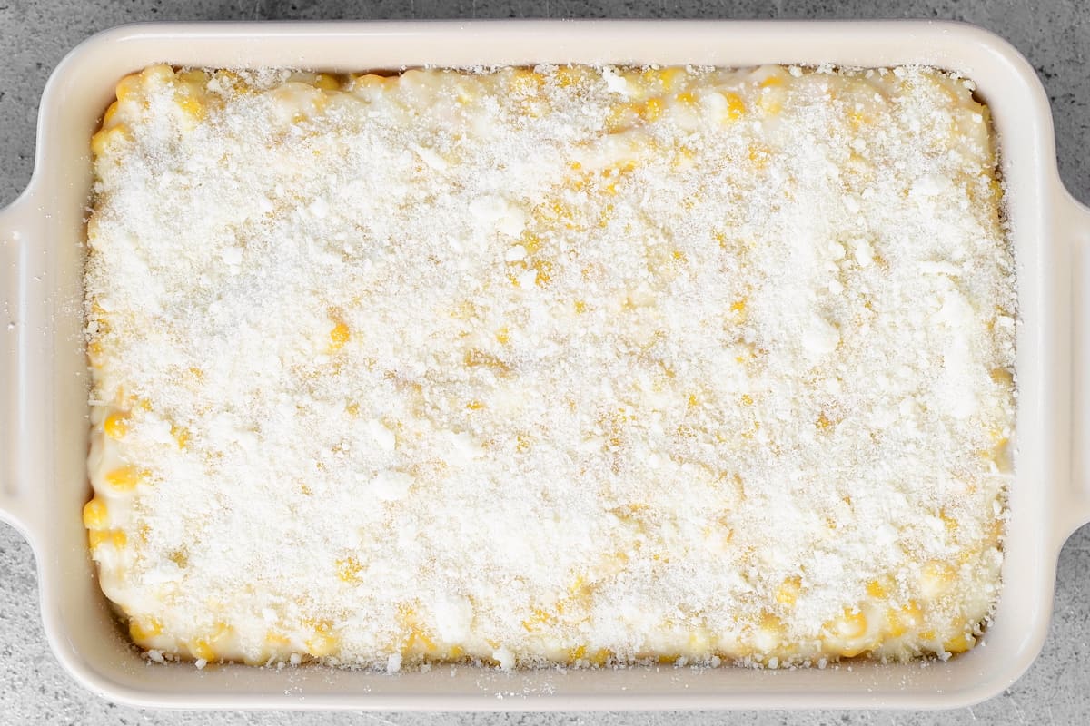 creamed corn with parmesan cheese sprinkled on top