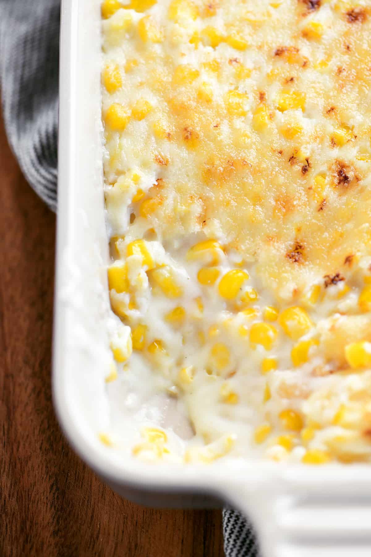 creamed corn in a dish with a serving removed