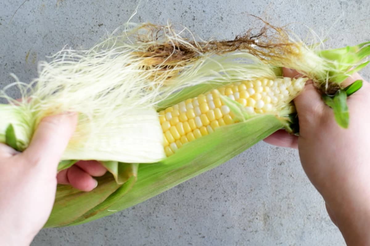peeling corn on the cob