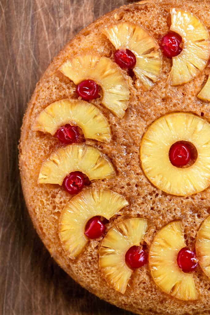 pineapple upside down cake on a wooden surface