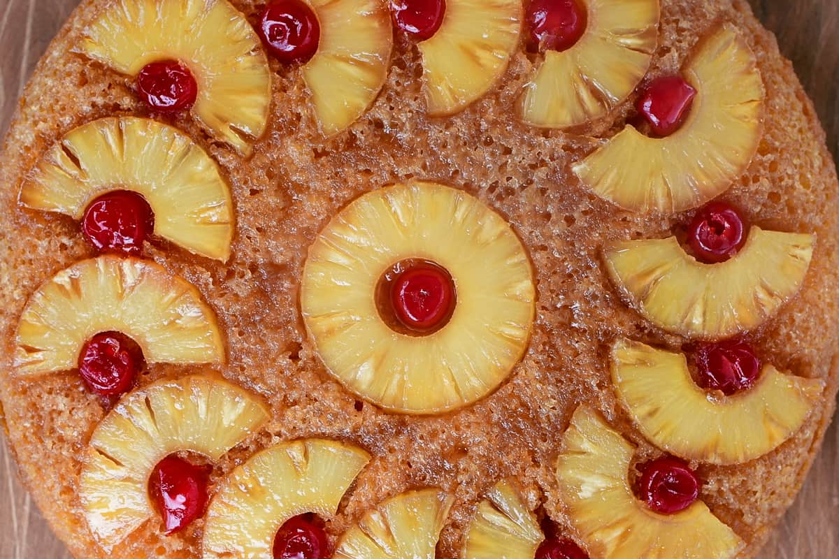 a baked pineapple cake with cherries on top