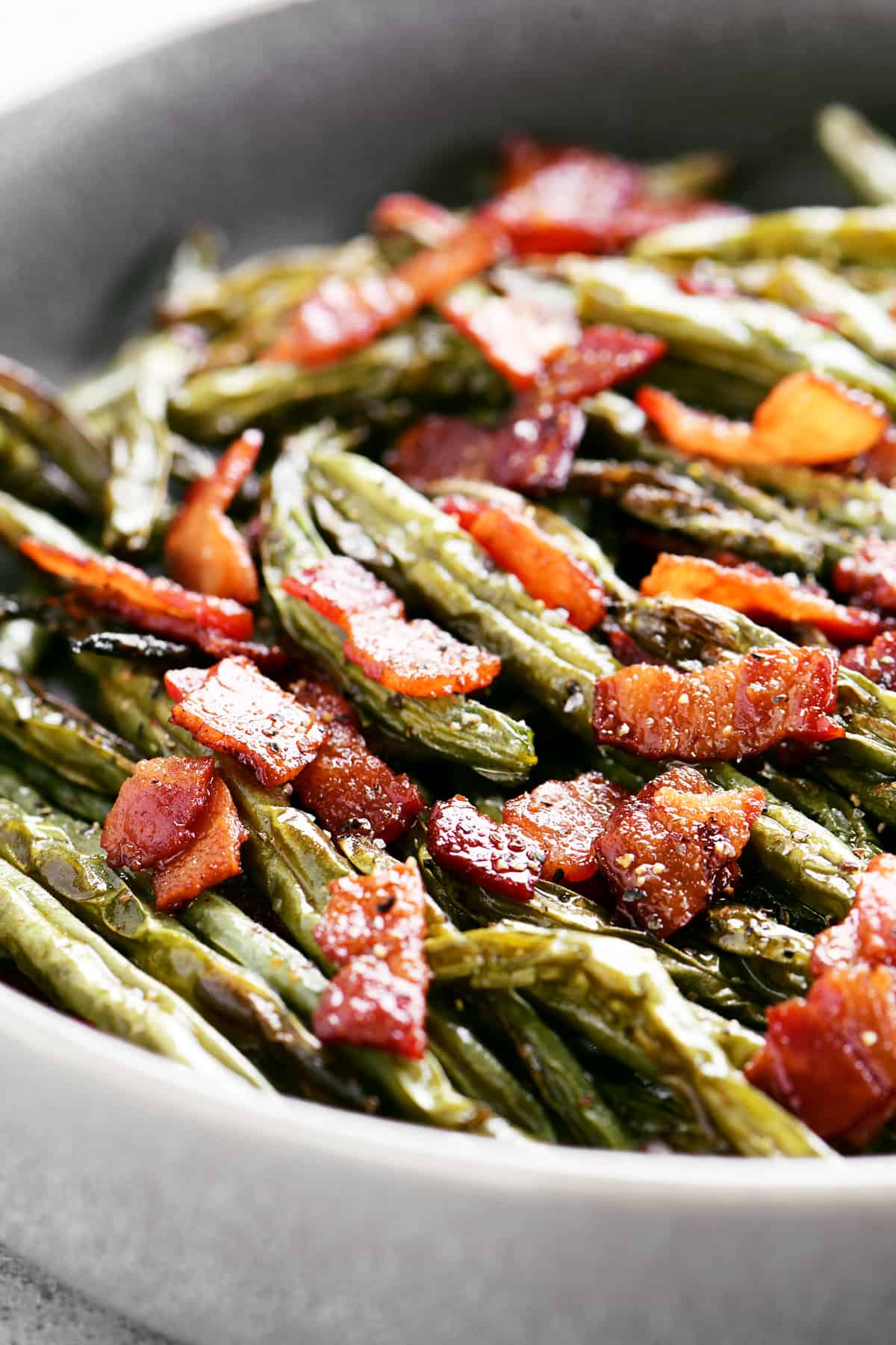 green beans with bacon and pepper in a dish