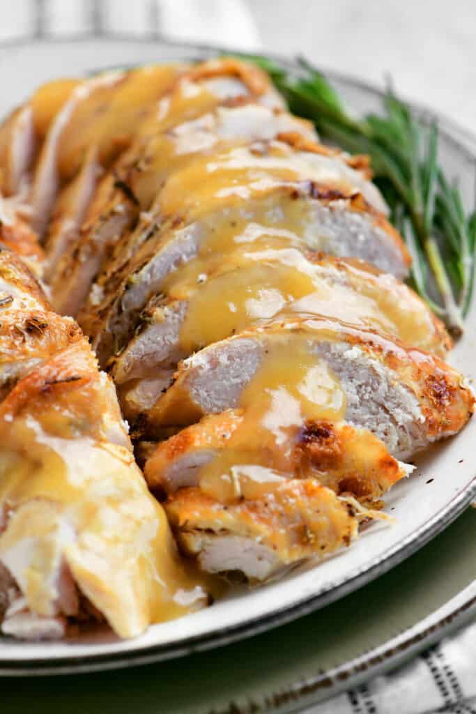 sliced slow cooker turkey breast on a plate