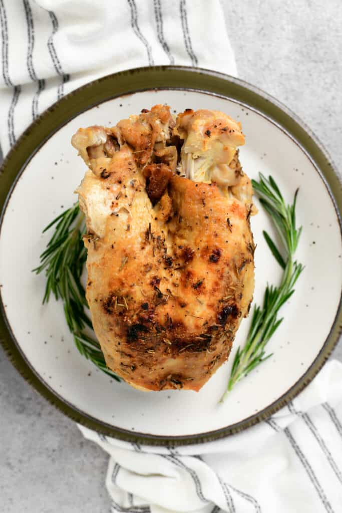whole slow cooker turkey breast on a plate
