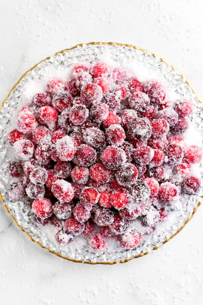 many sugar coated cranberries on a plate