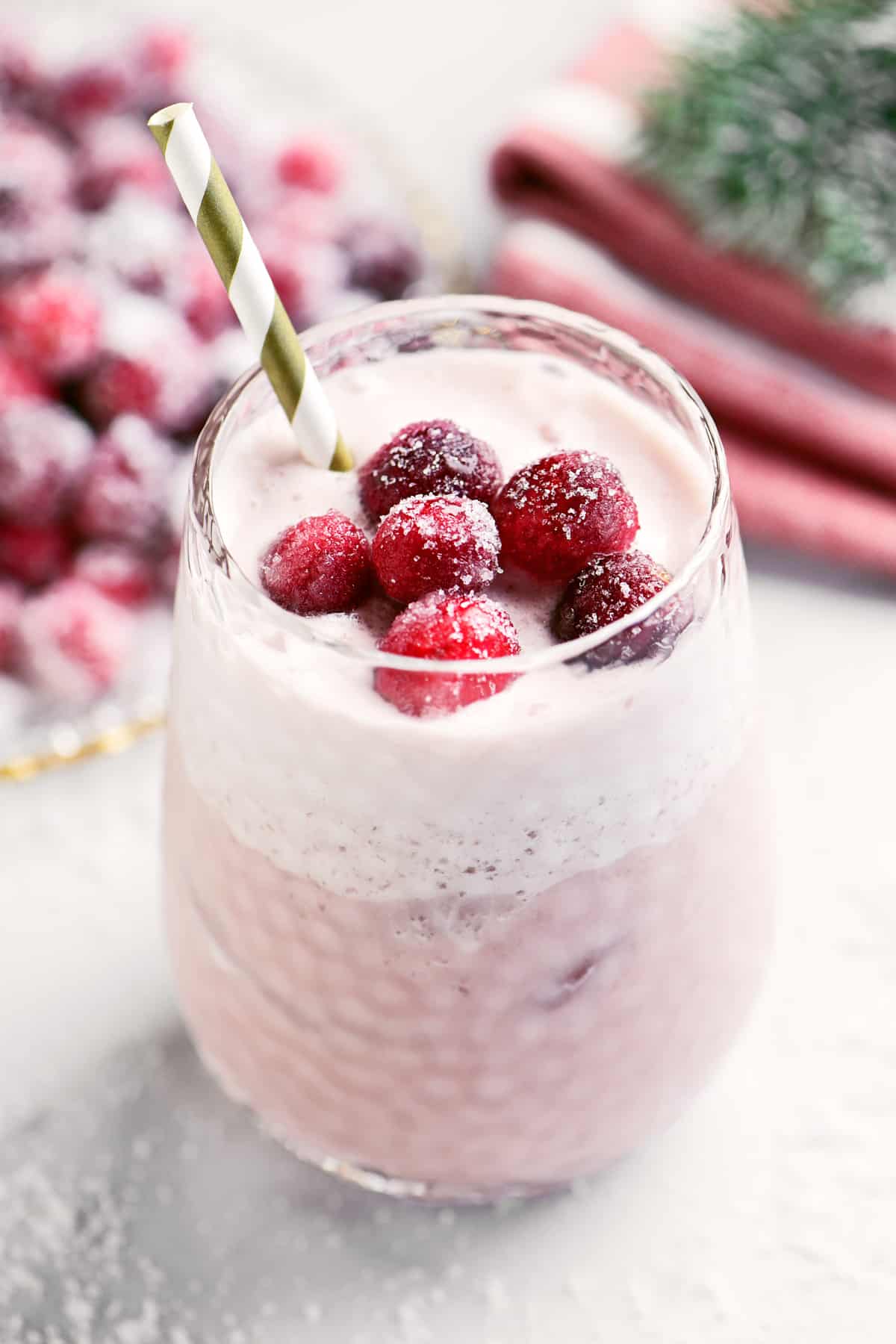 sugared cranberries in a cranberry whip drink