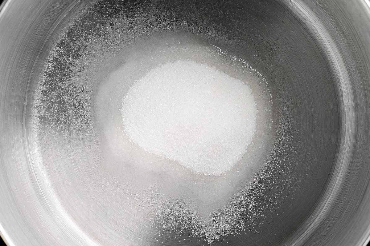 sugar and water in a metal mixing bowl