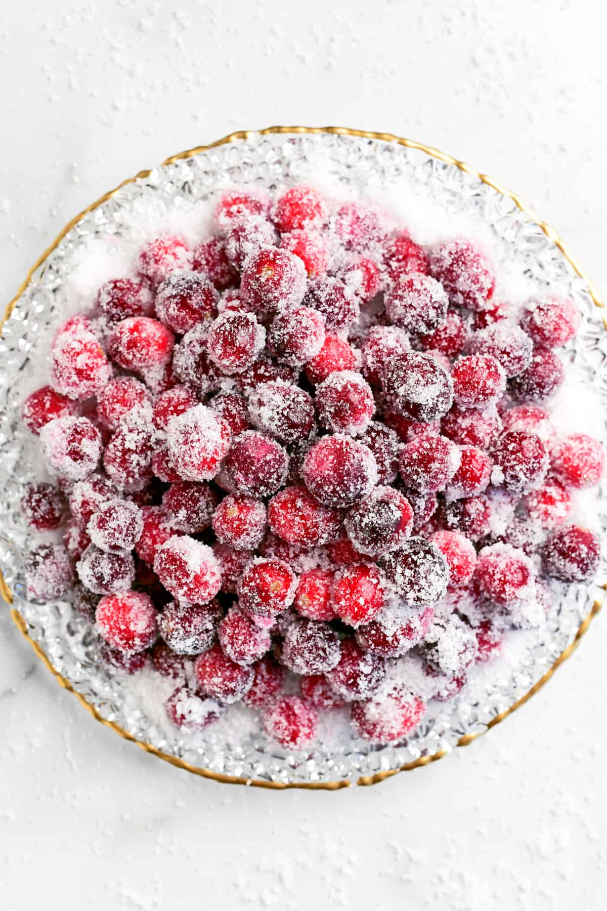 many sugar coated cranberries on a plate