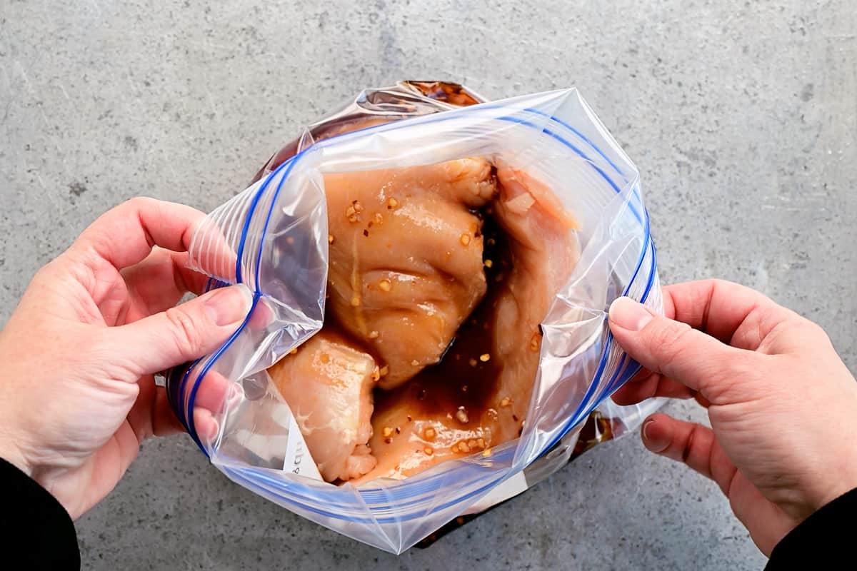 chicken breasts with marinade in gallon size bag