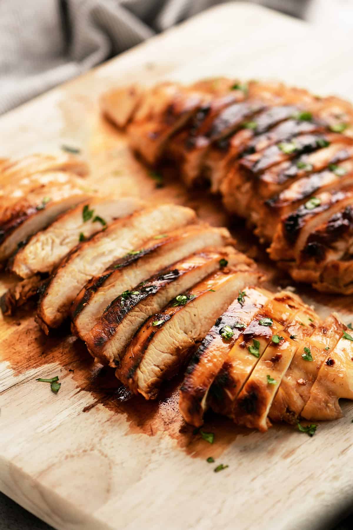 side view of grilled chicken cut into slices