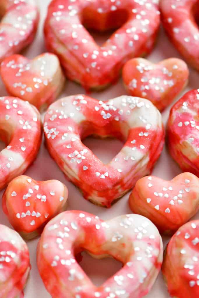 pink swirled heart shaped donuts and donut holes