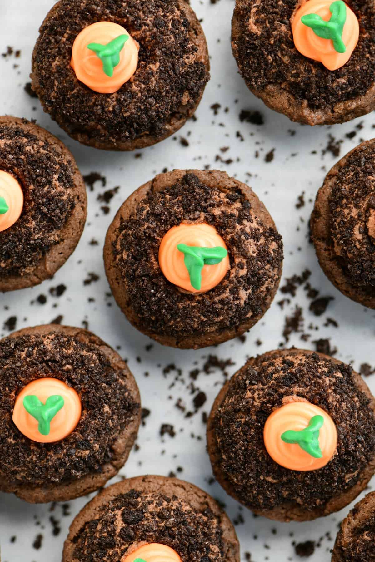 a topdown view of carrot patch cookie cups on parchment paper