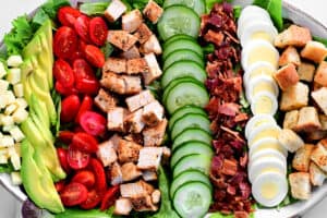 toppings for cobb salad lined up on a tray