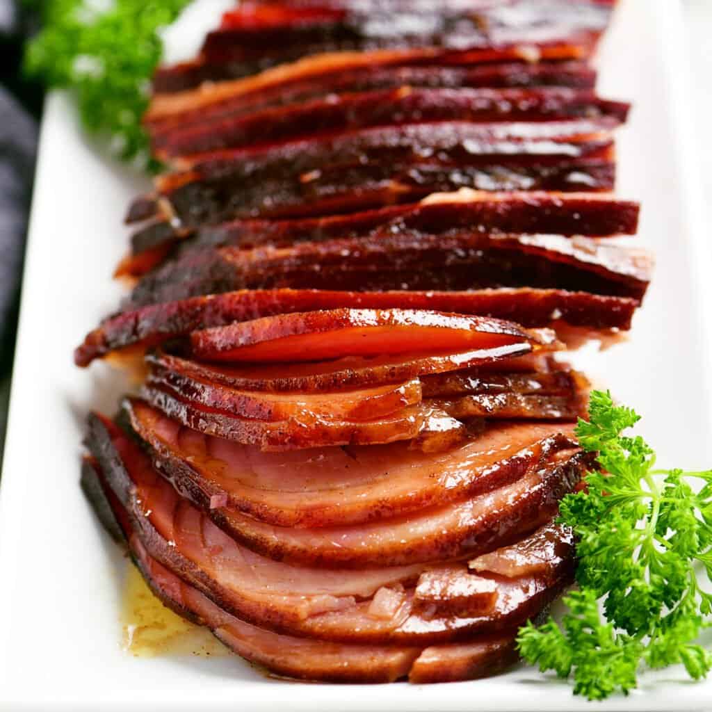 honey glazed ham slices on a platter