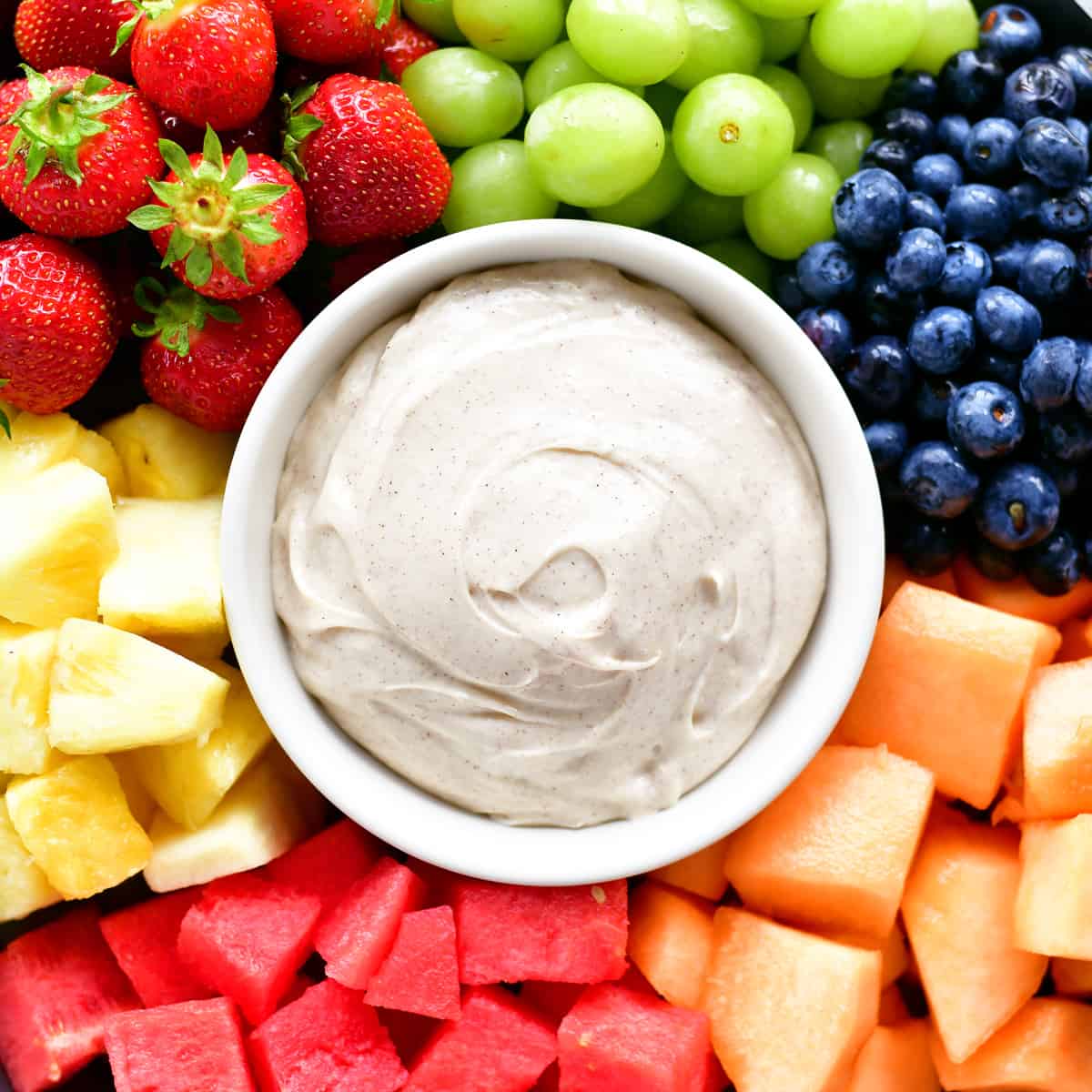 fruit dip in a bowl surrounded by fruit