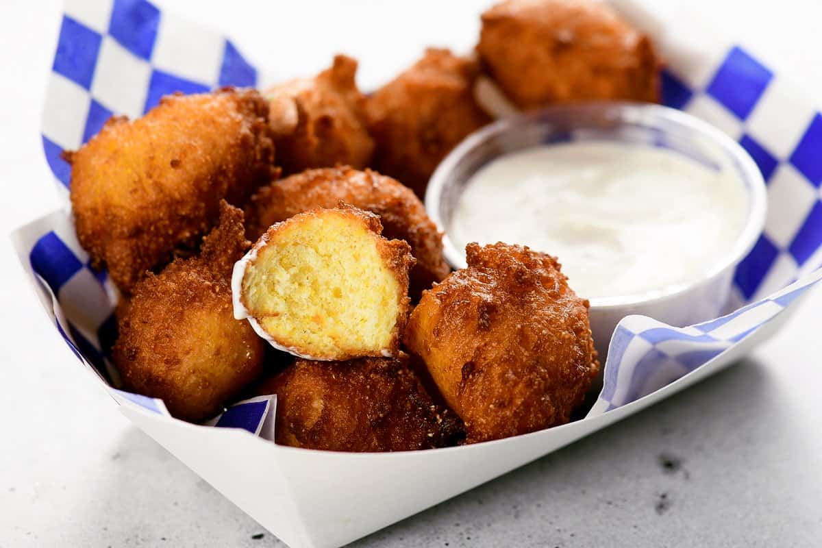 fried hushpuppies in a serving tray