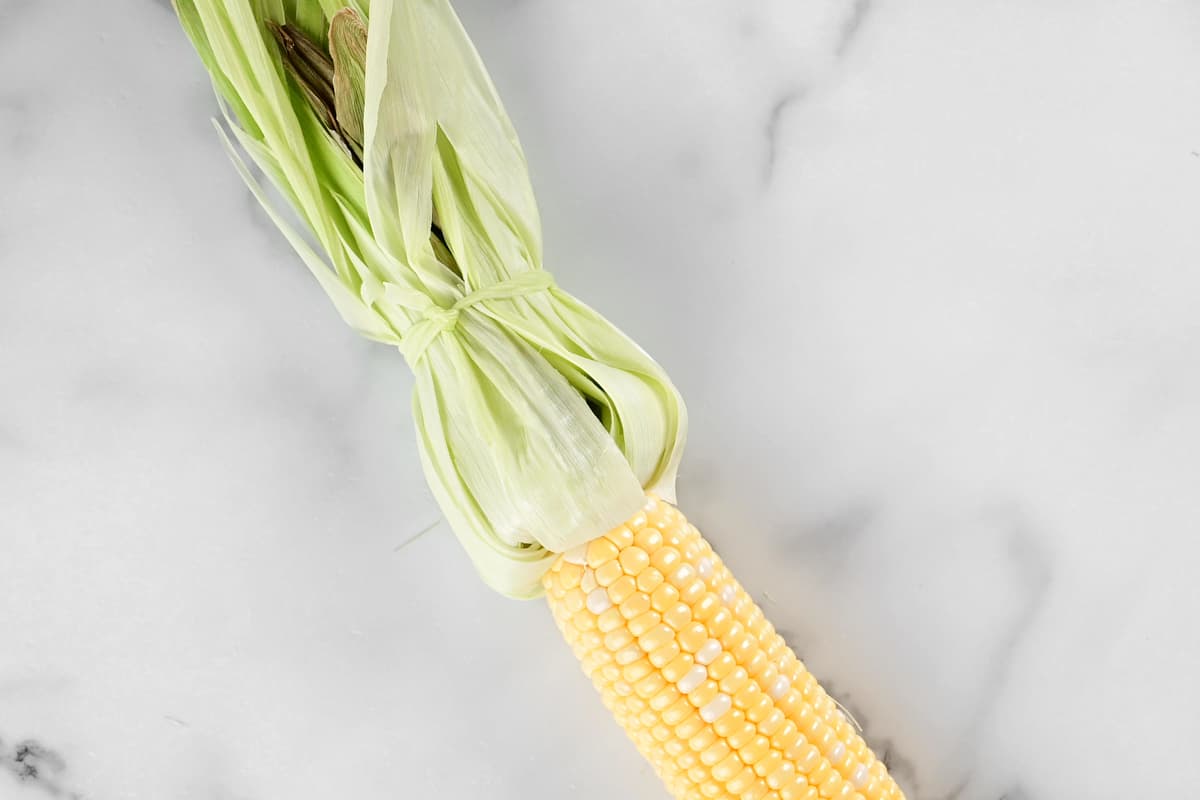 an ear of corn on a countertop