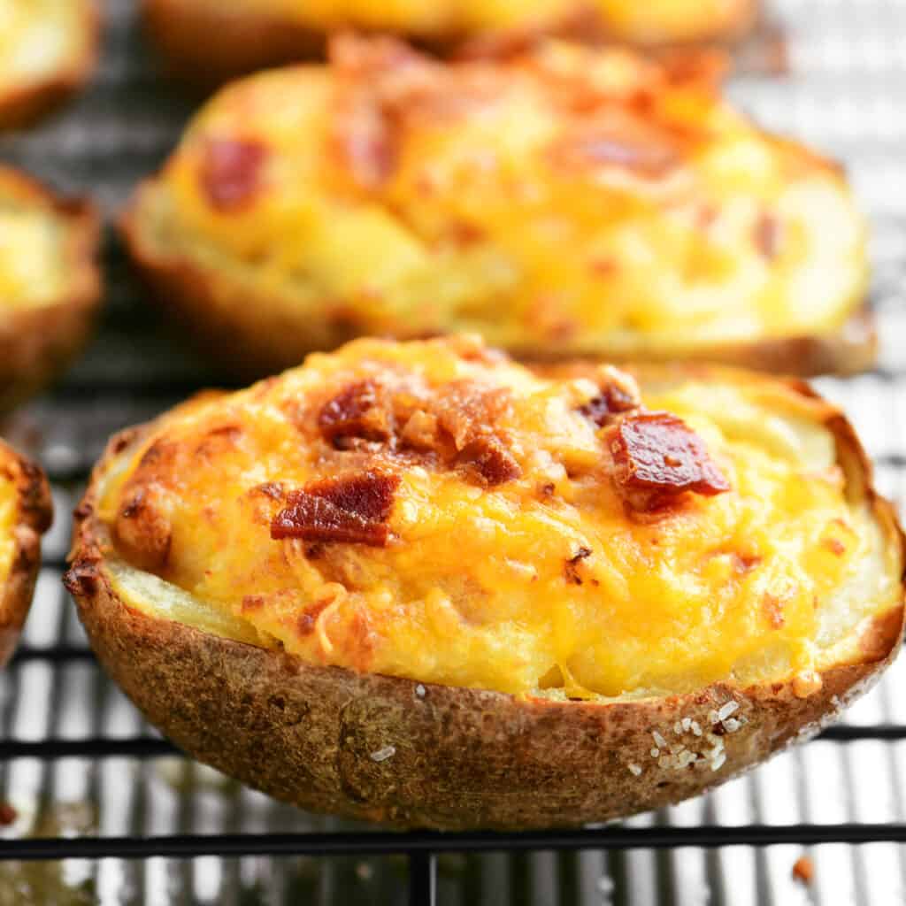 twice baked potato topped with cheese and bacon