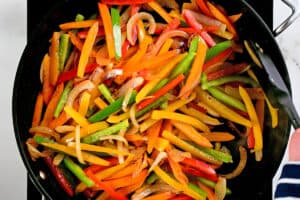 colorful peppers in a frying pan.