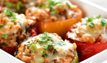 a casserole dish with stuffed peppers inside.