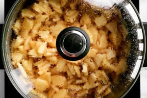 add lid to pot of cooking apples.