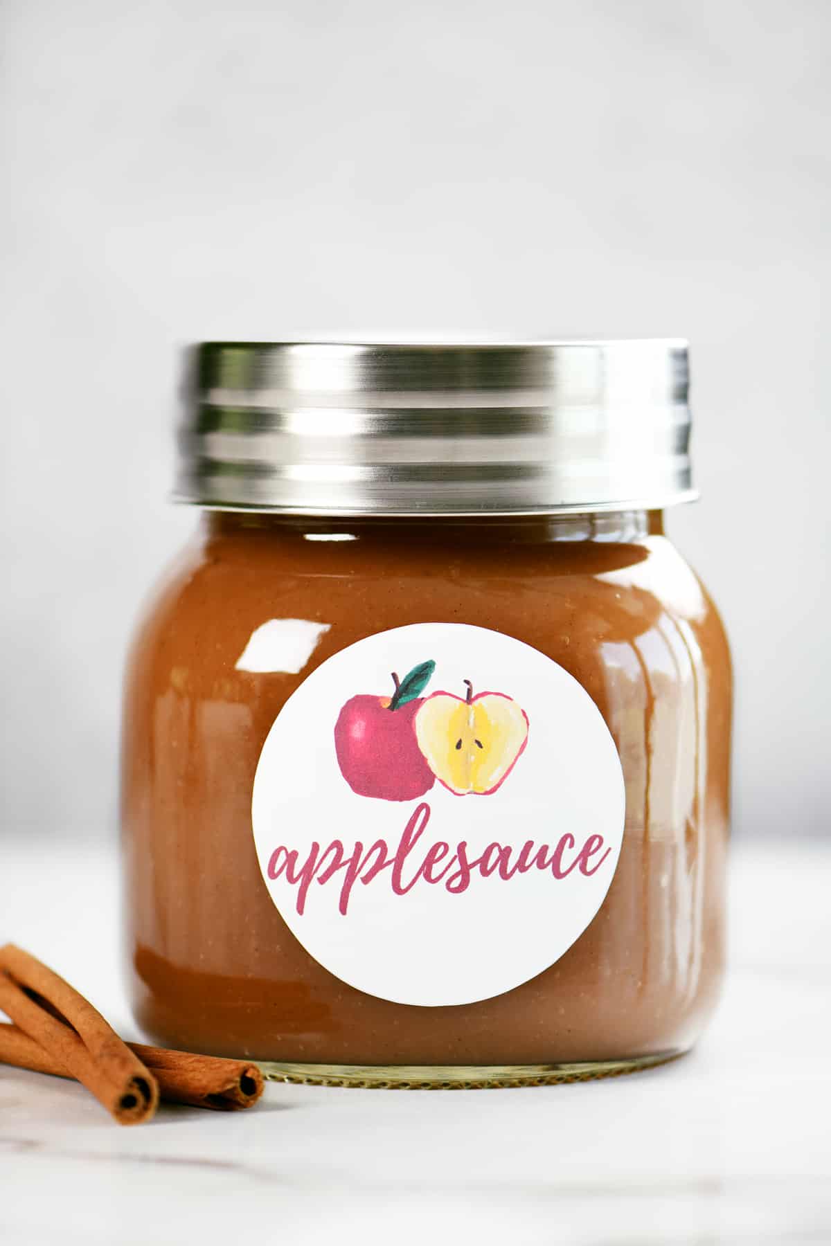 crockpot applesauce in a mason jar with a label on the front.