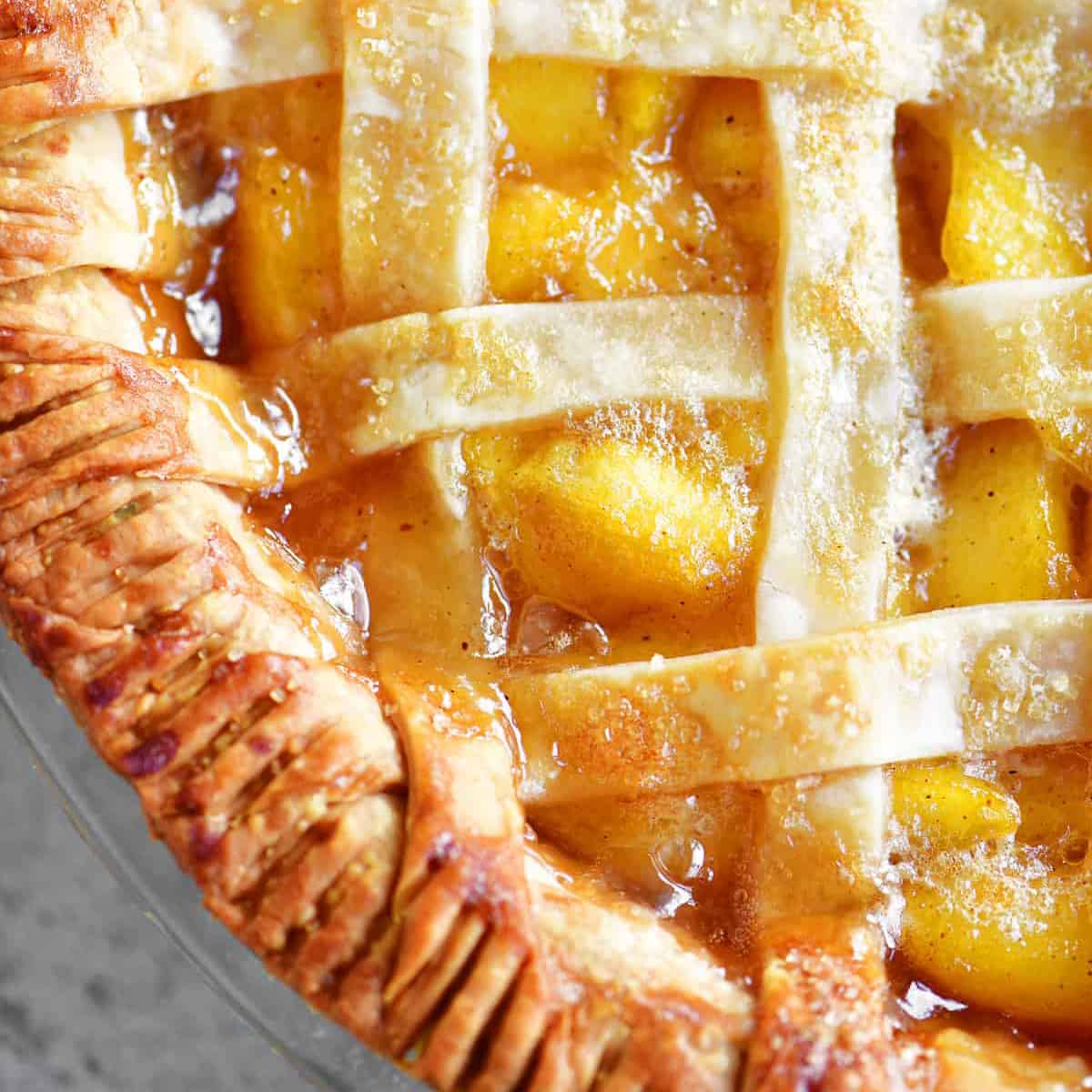 close up topdown view of a peach pie.