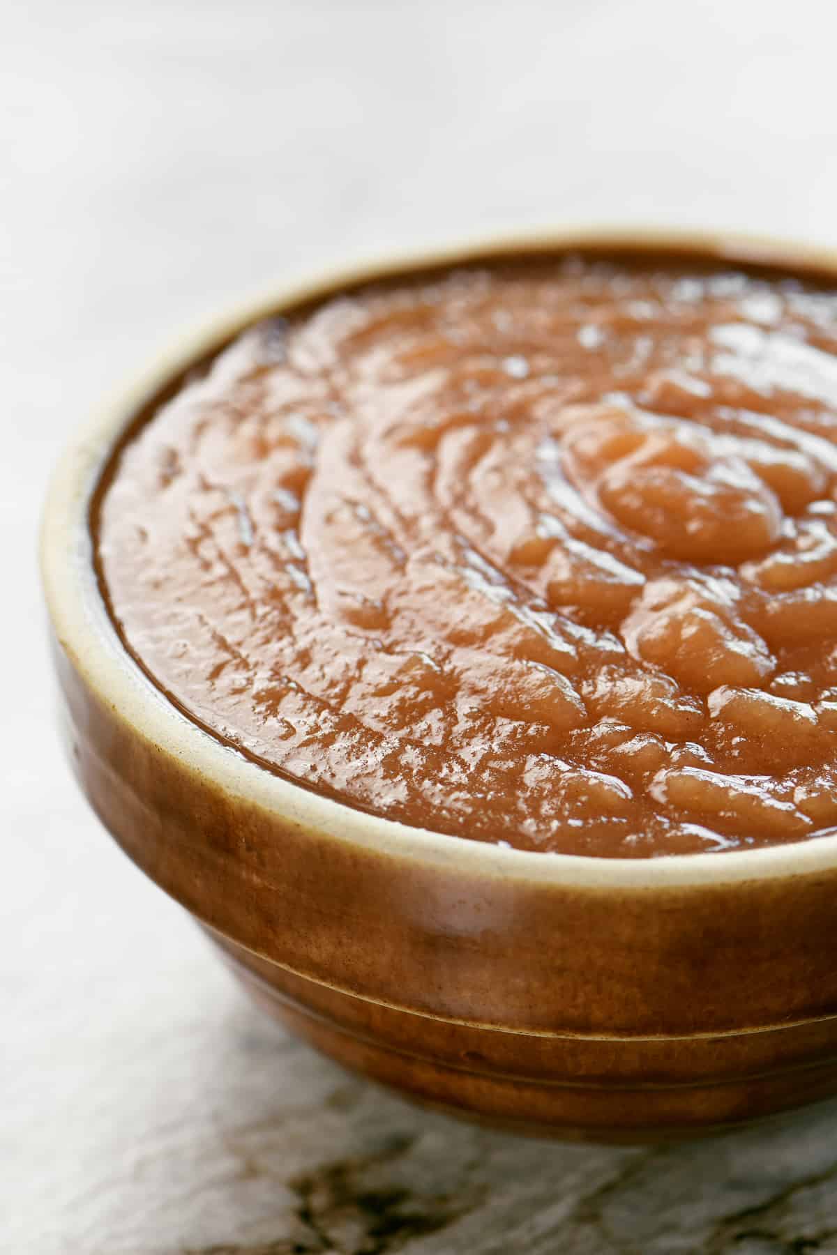 instant pot applesauce in a brown bowl.