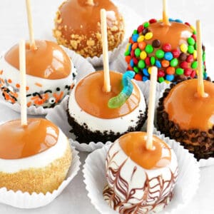 Gourmet caramel apples with toppings.
