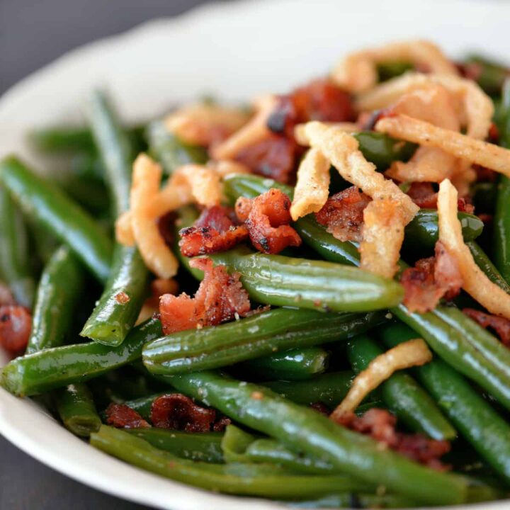 sauteed green beans in a white bowl