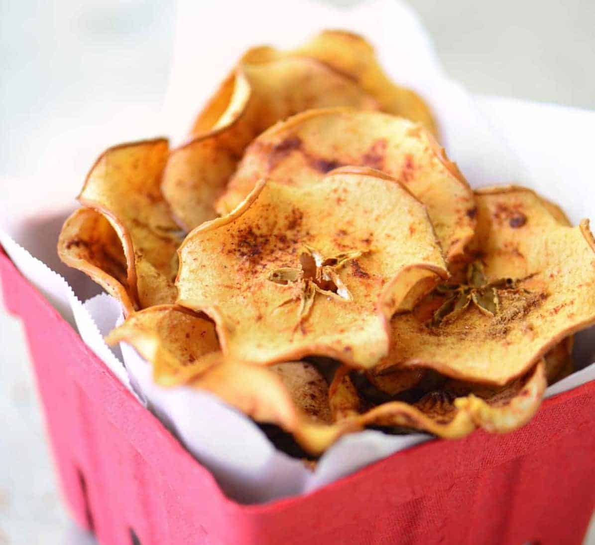 apple chips in a red berry basket.