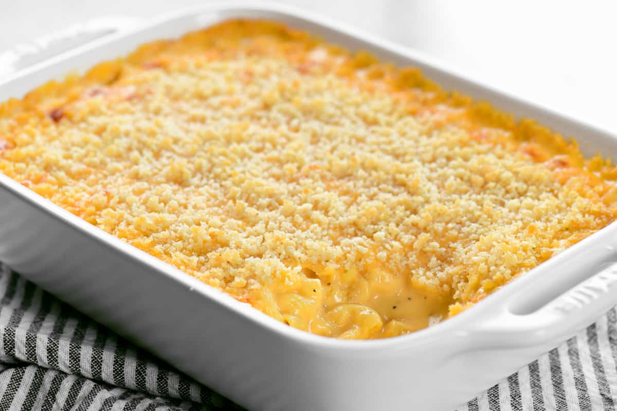 a white dish with mac and cheese inside