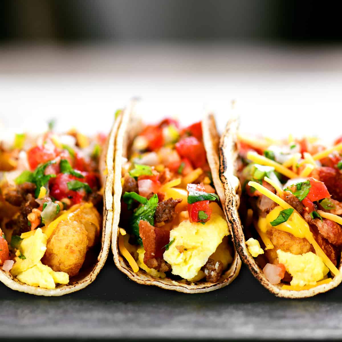 three breakfast tacos in a row.