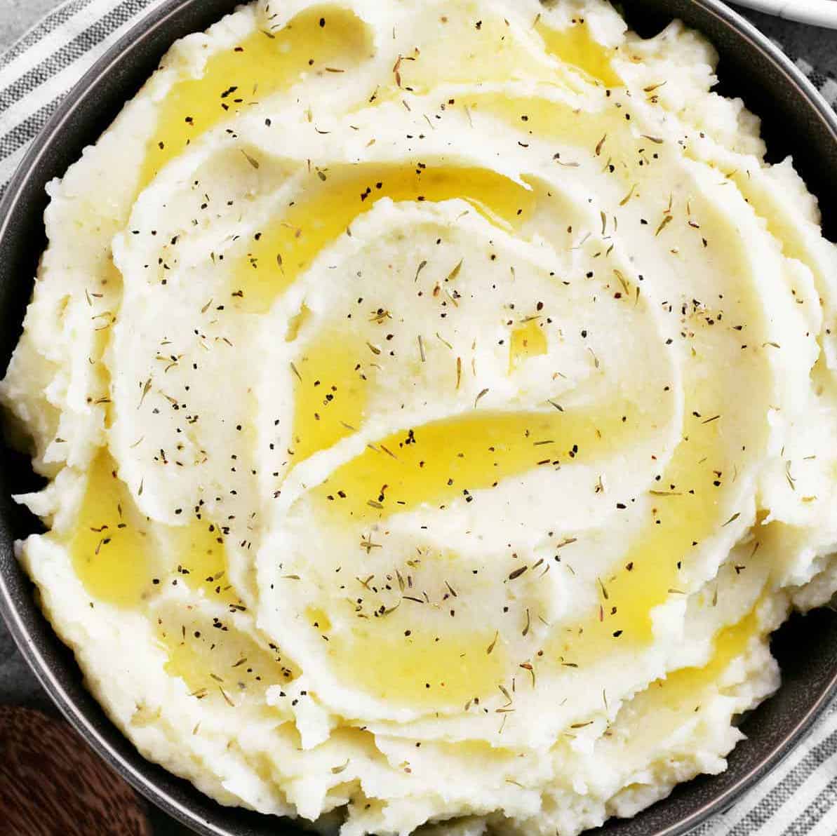 garlic mashed potatoes with butter on top.