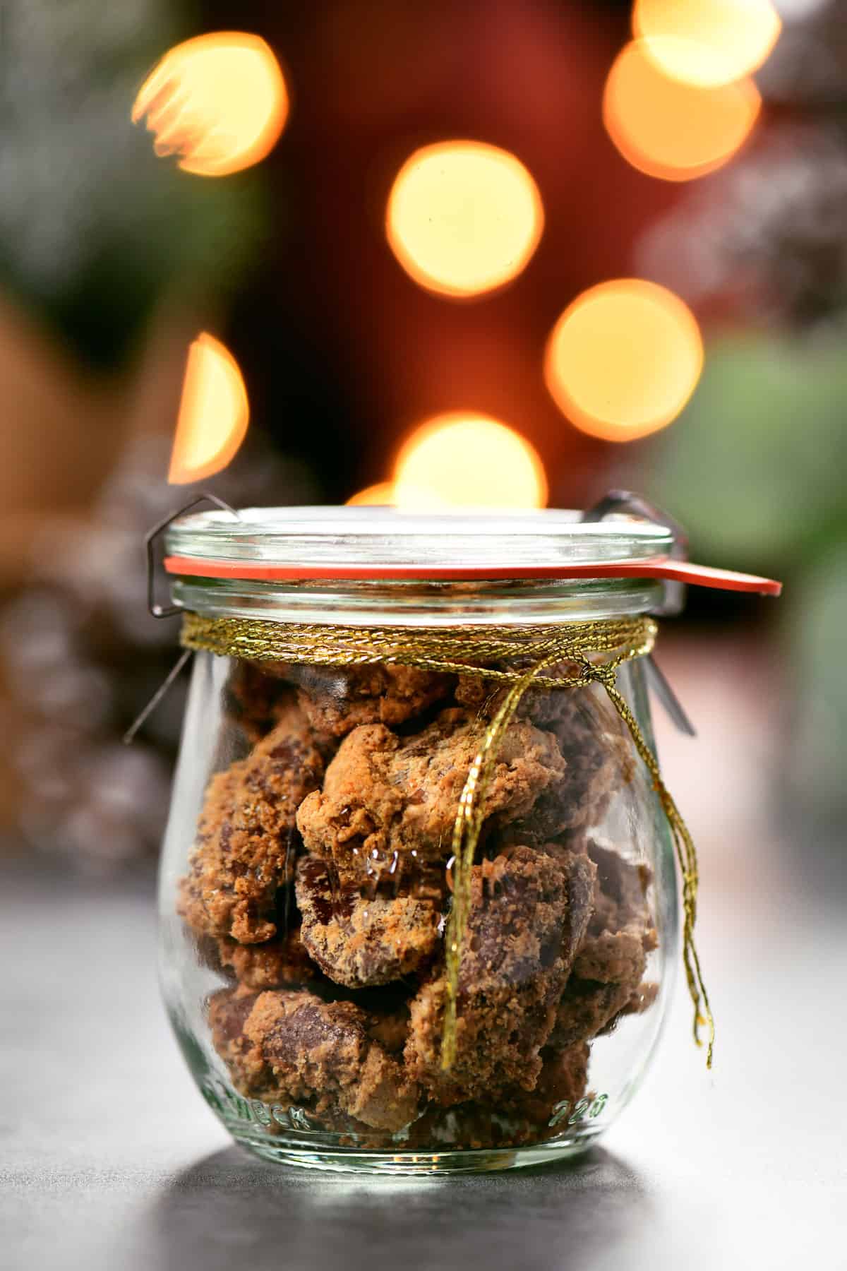 a mason jar filled with candied pecans